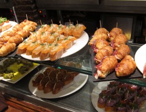 Spanish tapas: smoked salmon, croissant with jamon