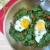 Sunny-side up egg breakfast skillet with kale, red peppers, & garlic